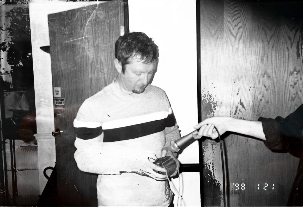Dave Allen playing a small thumb piano while I hold a microphone to it, at Eighth Dimension Studio in Orlando, Florida, 1998
