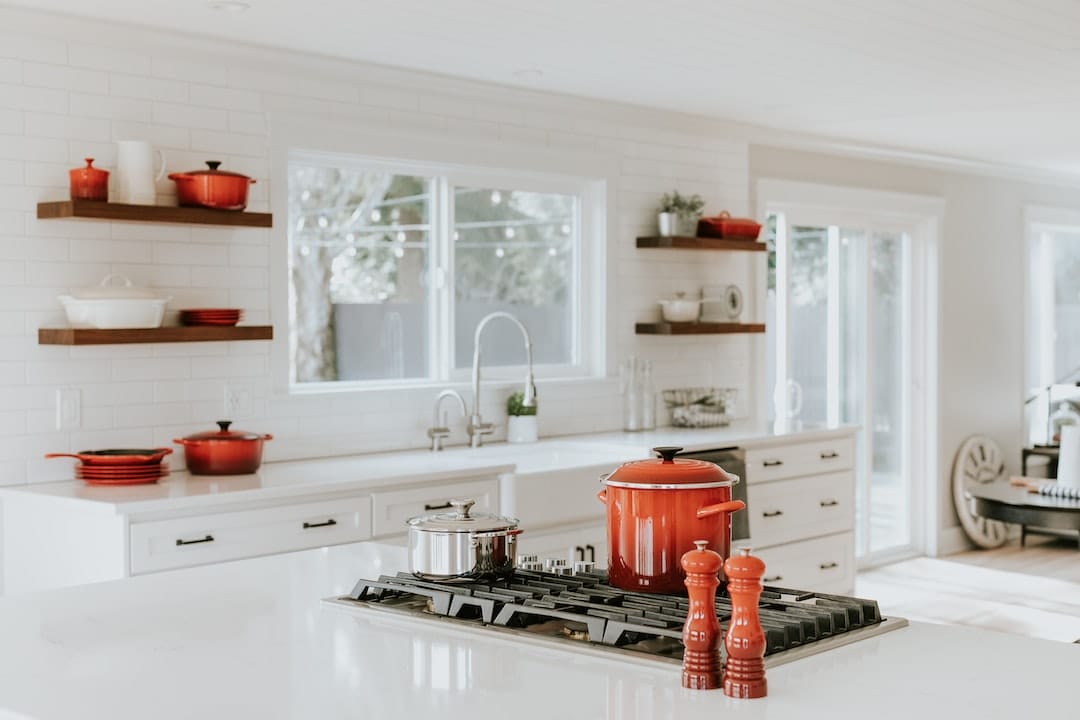 Red pots on kitchen stove
