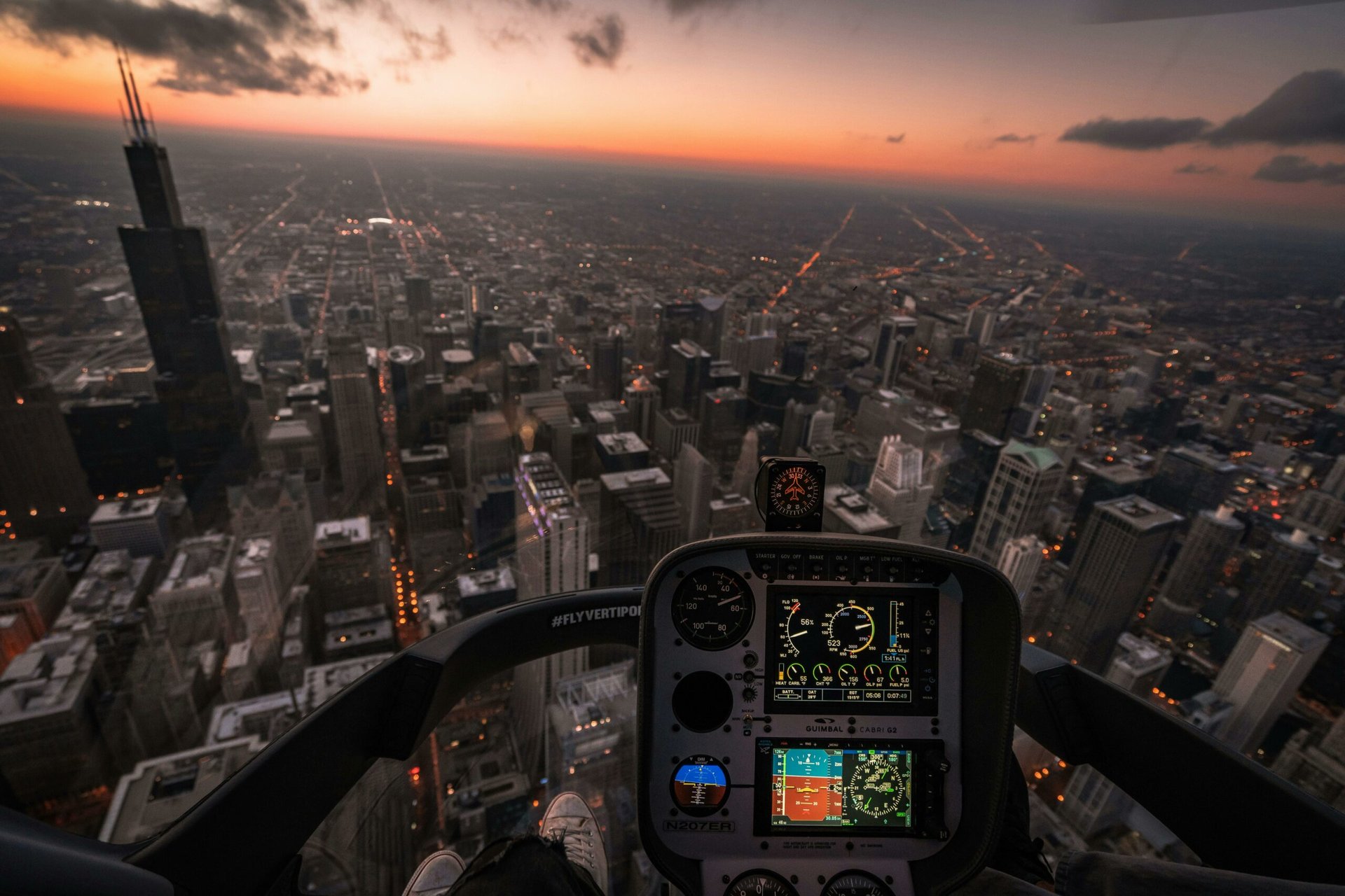 Aircraft flying over a city View of a city skyline through a plane cockpit.