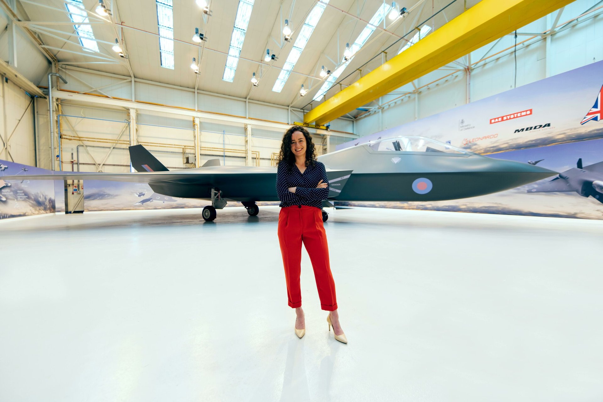 Aerospace engineer Female aerospace engineer in front of a jet.