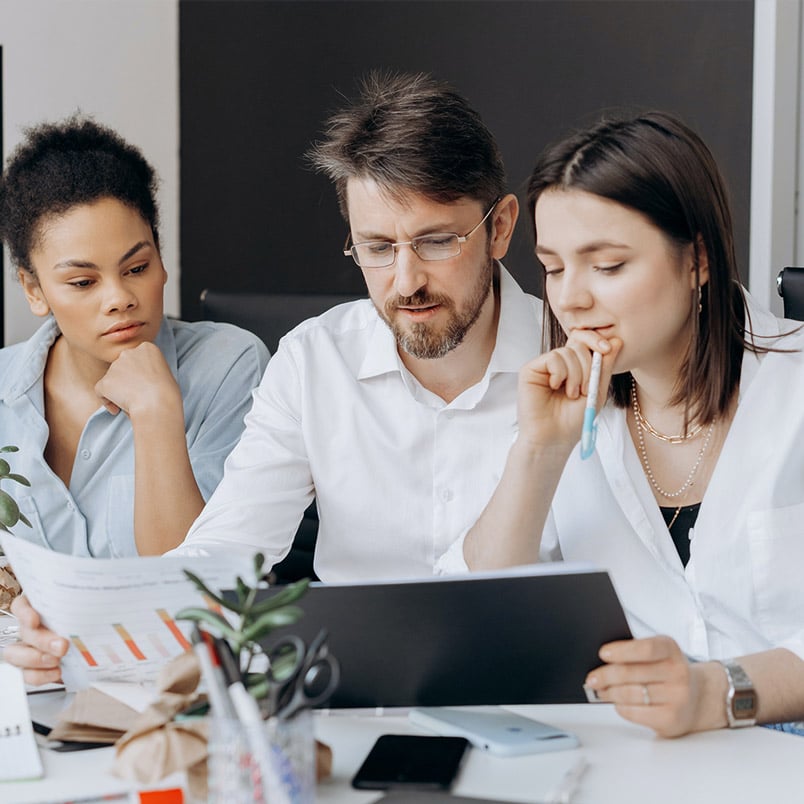 Group working Three engineers discussing design plans.
