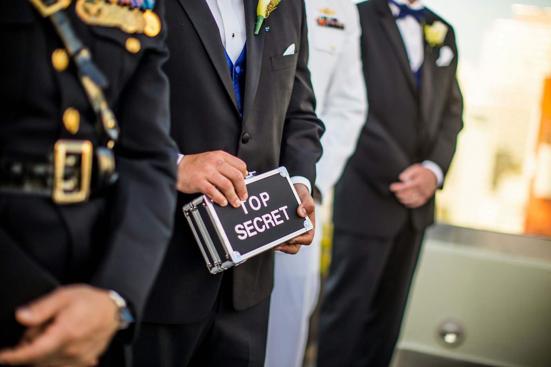 Security Clearance Image #2 Man holding a box with labeled as top secret.