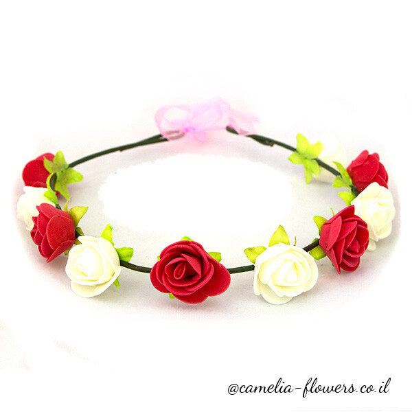 A flower crown with red and white flowers.