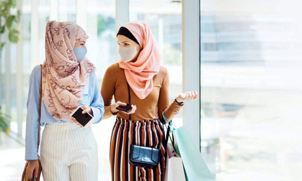 New immigrants are stitching masks that can be worn comfortably with a hijab