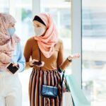 New immigrants are stitching masks that can be worn comfortably with a hijab
