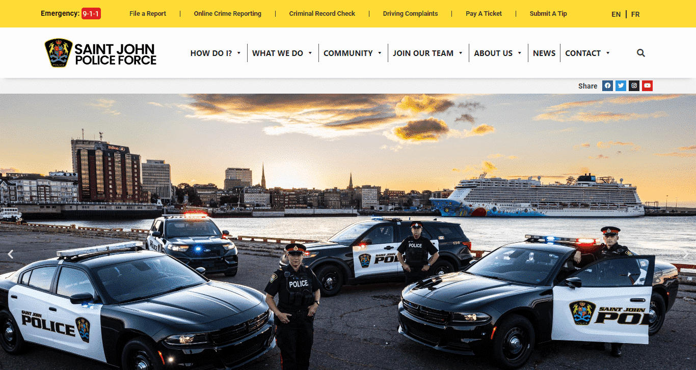 A police car is parked in front of the certtech web solutions building.