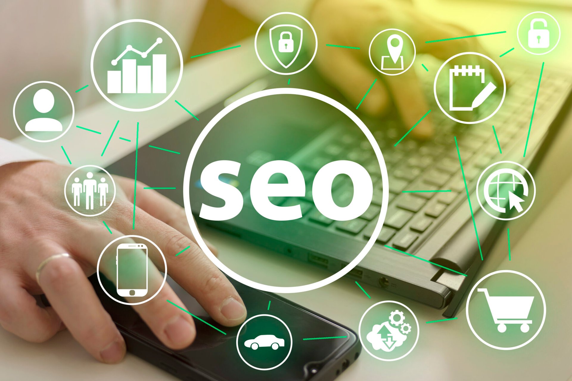 Hands expertly using a laptop and smartphone with SEO icons overlayed, illustrating the seamless use of technology in digital marketing and the strategic implementation of keywords.