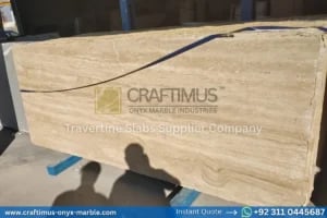 Stacked beige travertine stone slabs