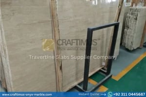 Stacked beige travertine stone slabs