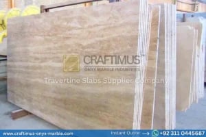 Stacked beige travertine stone slabs