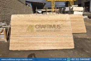 Stacked beige travertine stone slabs