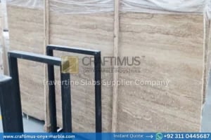 Stacked beige travertine stone slabs