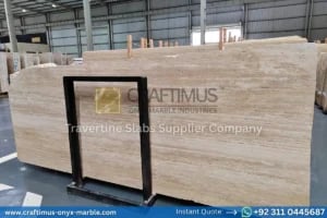 Stacked beige travertine stone slabs