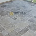 Silver Travertine Tiles on floor together for product display at stone fair