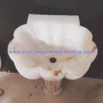 White onyx sink product image in washroom with watermark of company website name www.craftimus-onyx-marble.com