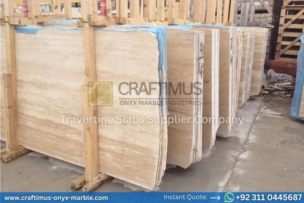 Stacked beige travertine stone slabs