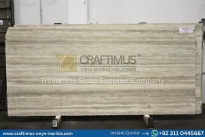 Stacked beige travertine stone slabs