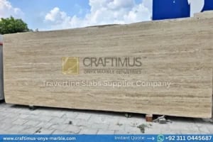 Stacked beige travertine stone slabs