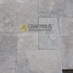 Silver Travertine Tiles on floor together for product display at stone fair