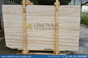 Stacked beige travertine stone slabs