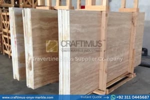 Stacked beige travertine stone slabs