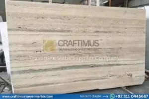 Stacked beige travertine stone slabs