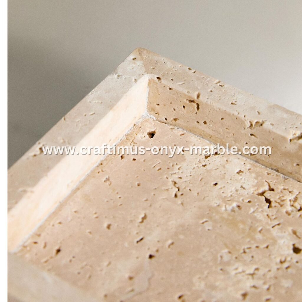 Handcrafted travertine rectangular tray with a textured natural stone surface and visible organic holes, designed as a multipurpose decorative platter for serving food, organizing bathroom essentials, or holding accessories on dining tables, kitchen counters, or vanity spaces.