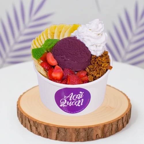 Fresh vegan acai bowl made with tropical fruits and granola, plant based healthy dessert from Acai Queen Bar Ubud and Kuta Bali.