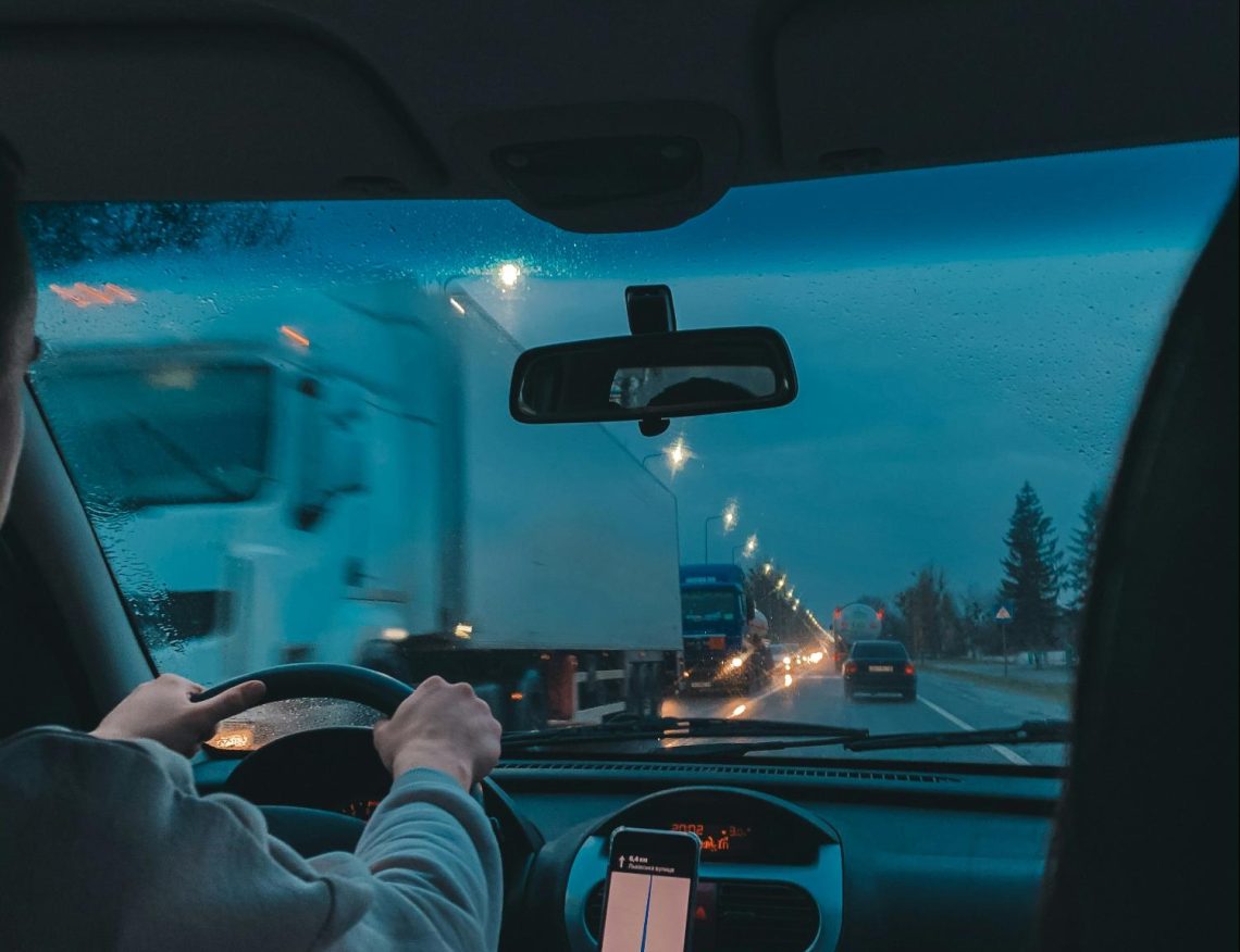 A person drives after certified auto glass installation in Denver