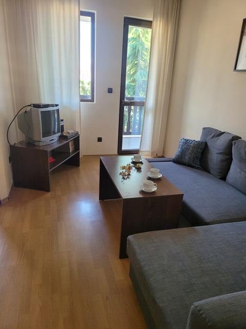 A living room with a couch and coffee table.