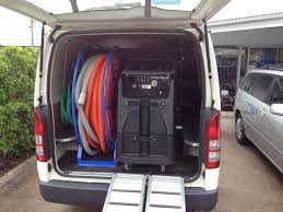 Franchise Opportunities 11 AustClean mobile cleaning van setup – professional truck-mounted carpet cleaning system with commercial hose reels and equipment for efficient on-site cleaning services by AustClean franchisees across Australia.