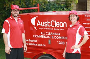 Mooloolaba Interior Cleaning 1 AustClean Mooloolaba cleaning team – two professionals in red uniforms smiling beside a branded trailer, providing trusted interior cleaning and carpet cleaning services in Mooloolaba, Sunshine Coast.
