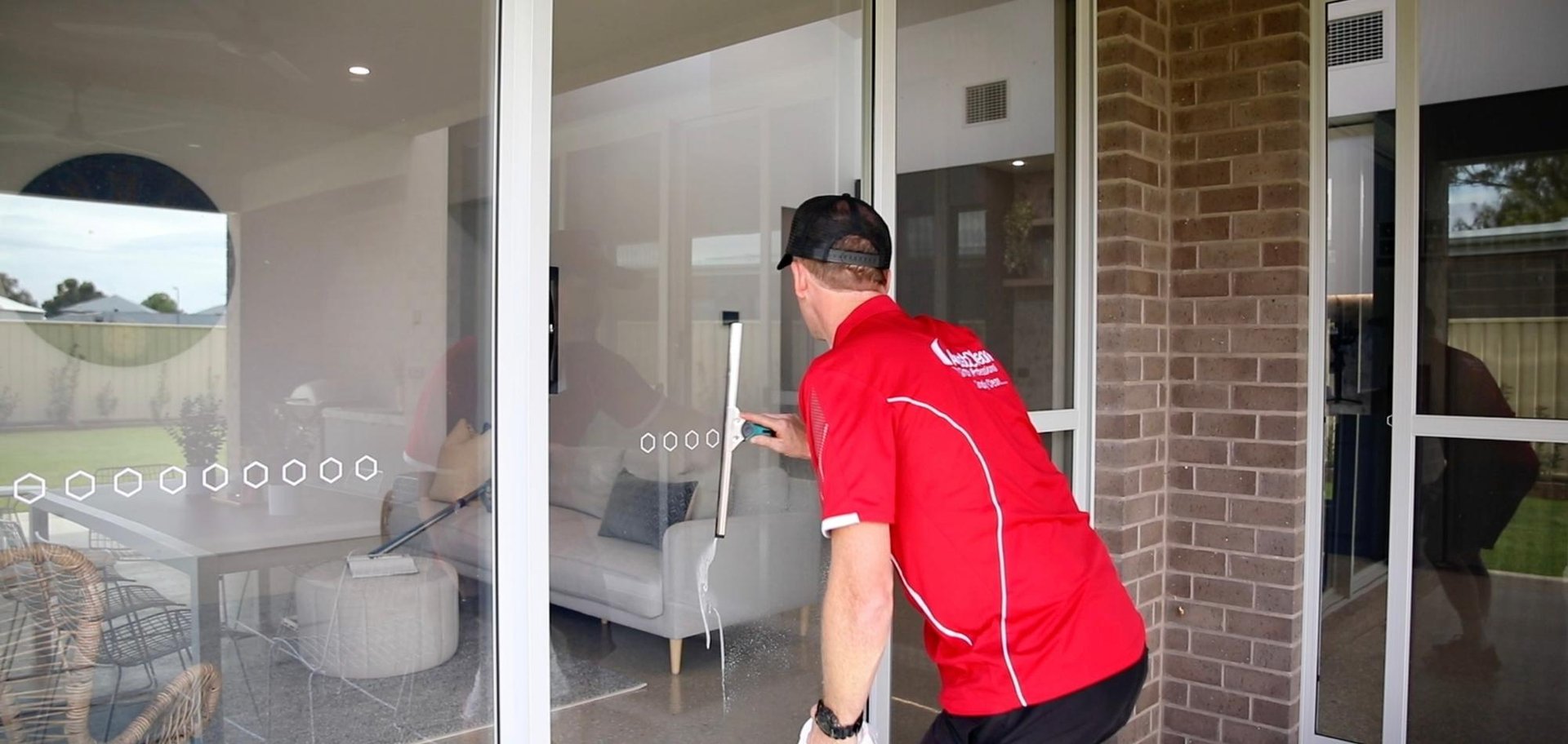 Exterior Cleaning 2 AustClean professional service van parked at residential property – mobile cleaning franchise offering domestic, commercial, exterior, and carpet cleaning services across Australia with branded vehicle displaying contact information.