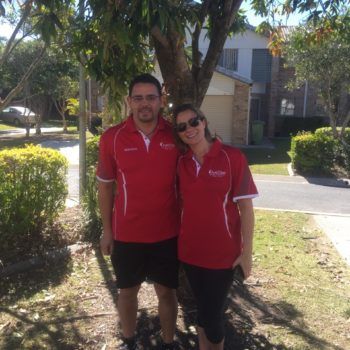 Merrimac Worongary & Surrounds 1 AustClean Tallai team – professional husband and wife cleaning duo in matching red AustClean shirts, representing trusted carpet cleaning and interior cleaning services in the Gold Coast Tallai area.