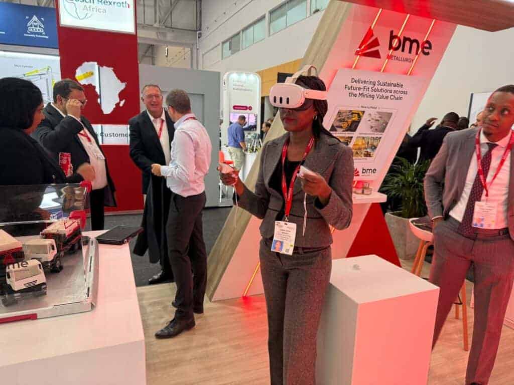 Mining Indaba drives collaboration for efficiency, sustainability. 4 BME team interacting with VR at the Mining Indaba 2025