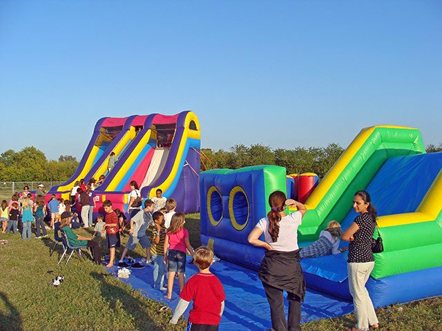 monster slide inflatable & Obstacle Course at a school event