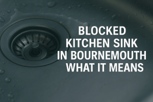 A high-resolution photograph showing a stainless steel kitchen sink with a blocked drain in Bournemouth. The image includes bold white uppercase text stating “Blocked Kitchen Sink in Bournemouth – What It Means.”