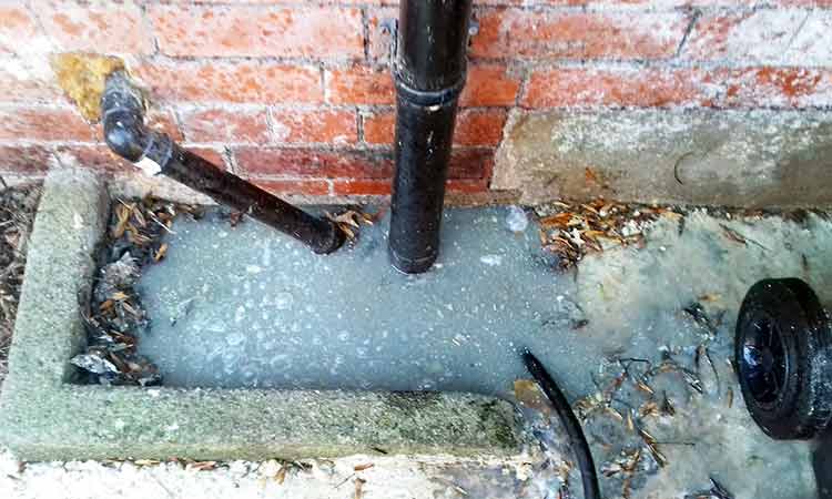 Bournemouth Drains24 engineer unblocking a kitchen drain and removing grease buildup