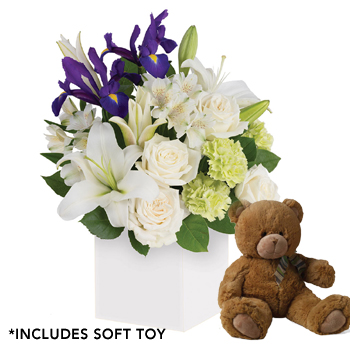 flowers in a box with teddy