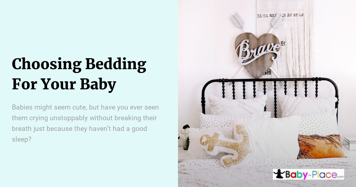 A neatly made baby crib with white bedding, decorative pillows, and a wooden heart sign reading "Brave" hangs above the headboard. Text on the left discusses choosing bedding for babies.