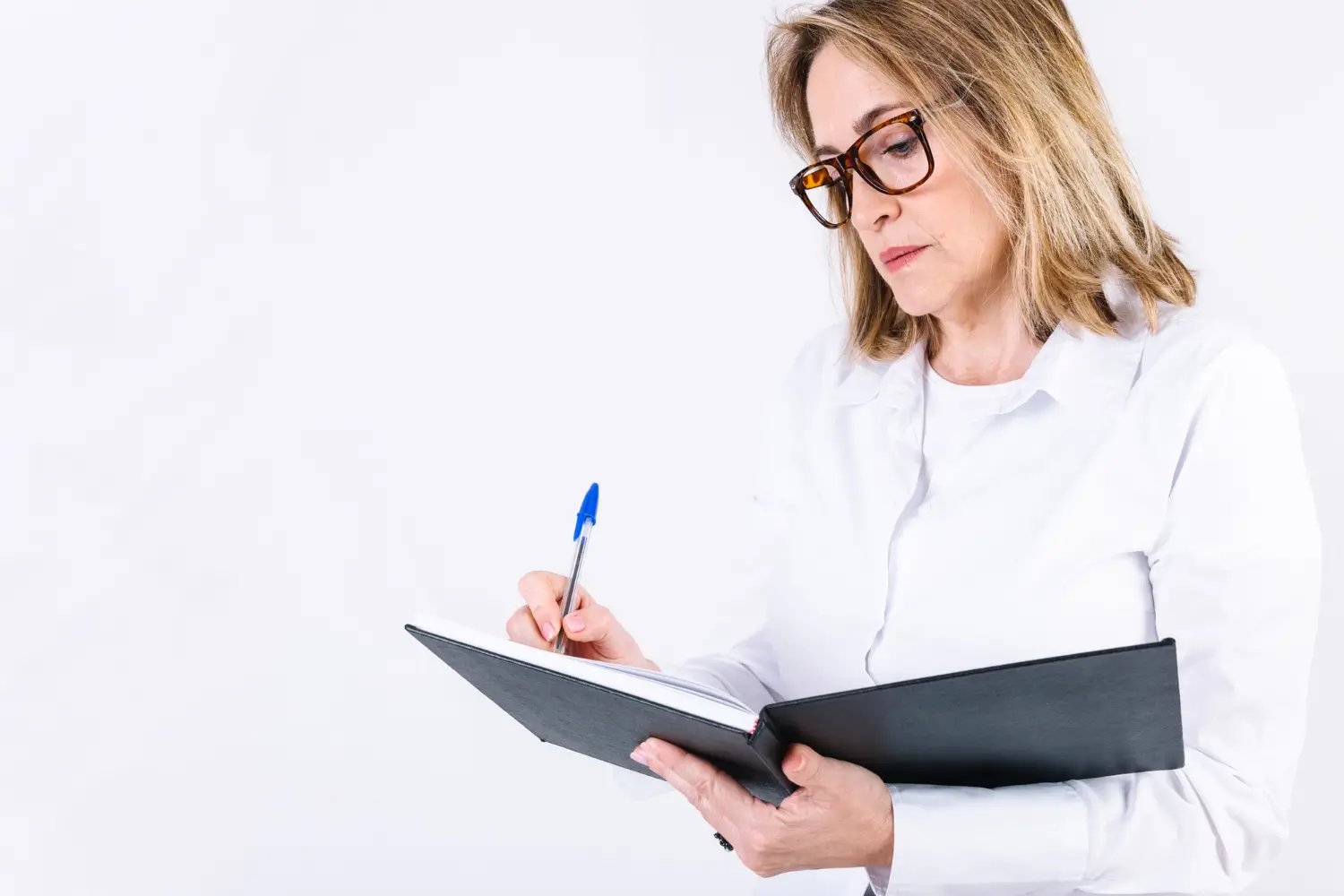 woman conducting business valuation a woman holding a pen and a notebook conducting a business valuation