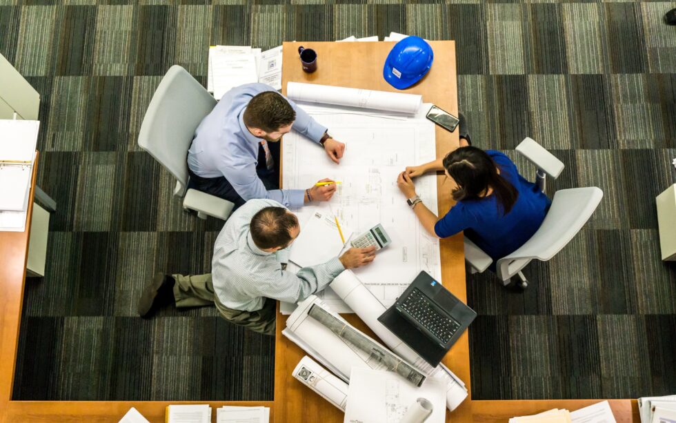 Corporate blogging meeting with all involved teams around a table