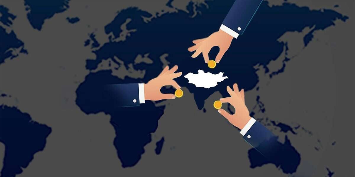 Three hands placing coins over a map of Jamaica. Two hands appear from the top, one from the bottom, against a world map background. The map of Jamaica is highlighted in white.