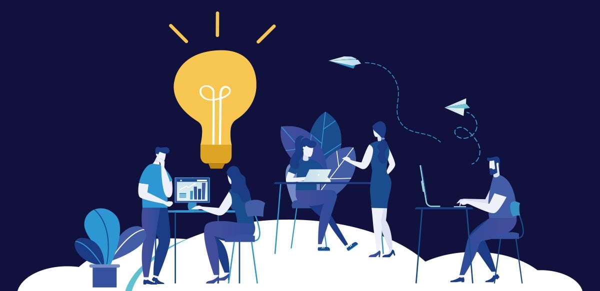 Illustration of five people working on laptops and tablets, a glowing lightbulb above them symbolizing ideas—reflecting Залуу ажилтнуудаа чадавхжуулах нууцаас. Two paper planes and plants decorate the dark blue backdrop.