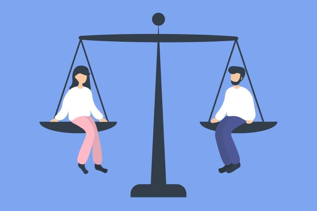 Зүүн талд сууж буй эмэгтэй, баруун талд сууж буй эрэгтэй хүнтэй тэнцвэртэй жингийн дүрслэл. Аль аль нь цагаан цамц өмссөн тайван харагдаж байна; эмэгтэй нь ягаан өмд, эрэгтэй нь цэнхэр өмд өмсдөг. Арын дэвсгэр нь бизнес дэх энтрепренерүүдийн хоорондын тэгш байдлыг илэрхийлсэн цайвар цэнхэр өнгөтэй байна. - Business.MN