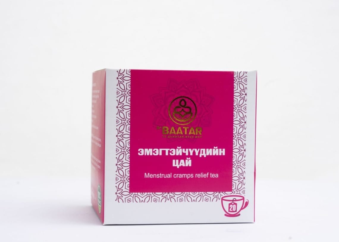 A pink and white box of Baatar brand "Menstrual cramps relief tea" with decorative patterns. The front features text in both English and another language. There's an icon of a cup indicating the contents are tea bags, totaling 20.