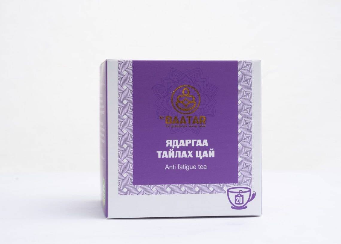 A purple box of "Baatar Anti Fatigue Tea" with decorative patterns and text in two languages. The bottom right corner features a symbol of a cup with the number 20 inside.