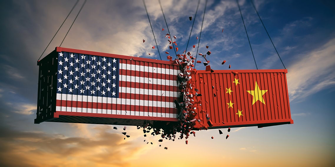 Two shipping containers collide in mid-air against a sunset sky. The left container features the U.S. flag, while the right displays the Chinese flag. The collision results in a dramatic spray of debris.