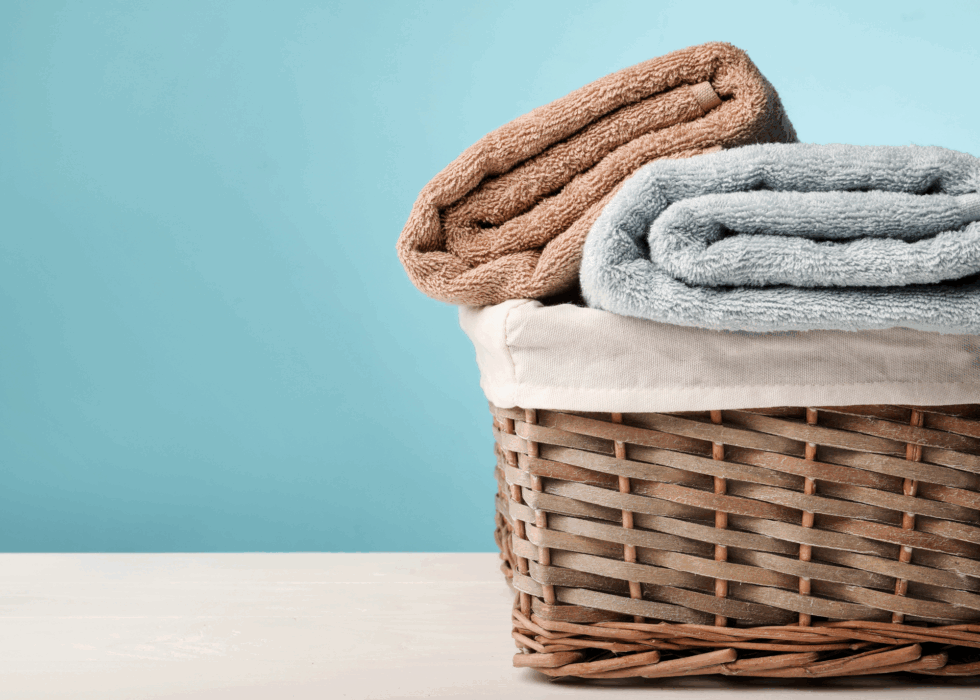 towels folded in a laundry basket towels folded in a laundry basket