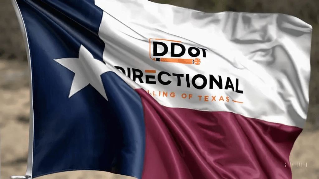 Texas flag blowing in the wind with DDoT logo